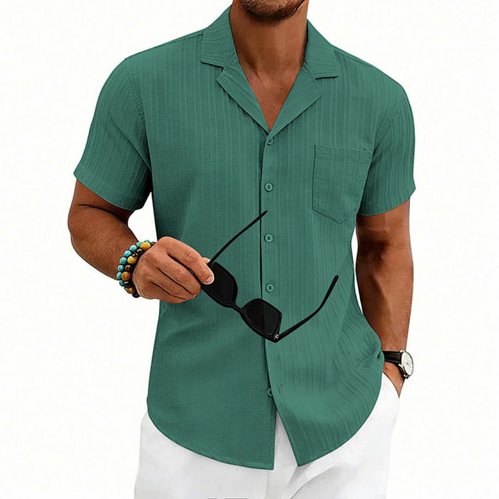 Men's Casual Cuban Neck Short Sleeve Shirt in green, model holding sunglasses, stylish summer outfit.