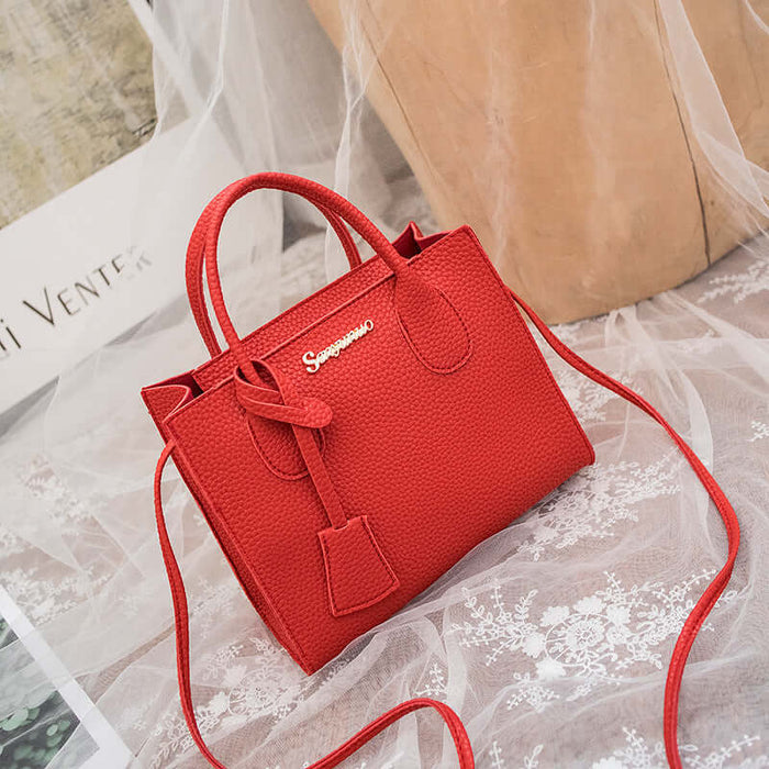 New Product Personality Messenger Phone Shoulder Bag in vibrant red color on a lace background.