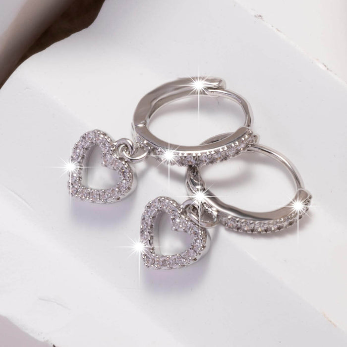 Retro Heart-shaped Pendant Ring Zircon Earrings with sparkling zircon details on a white background.