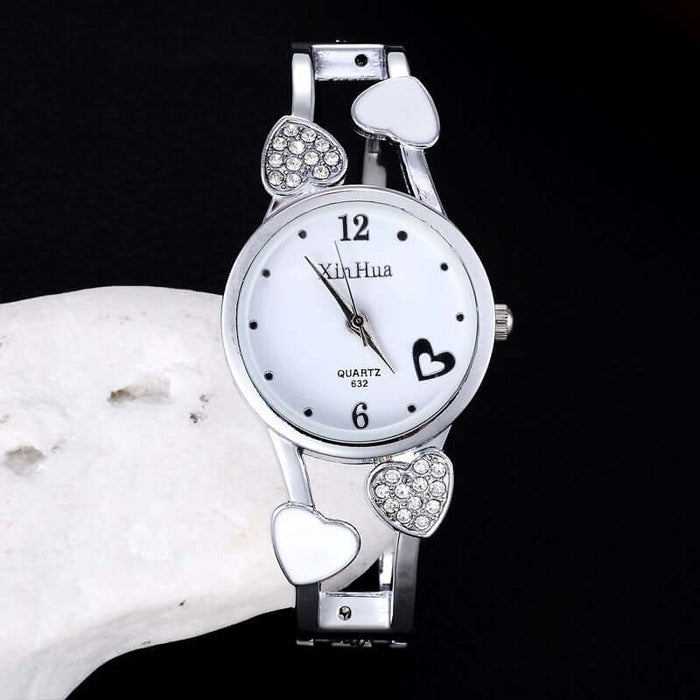 Women's British Diamond Watch featuring a quartz movement and decorative heart accents.