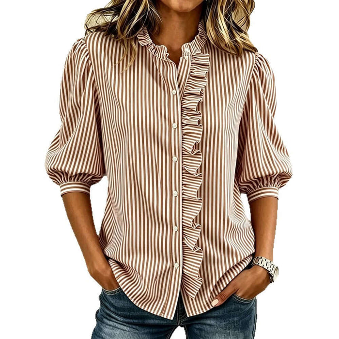 Women's Striped Puff Sleeve Blouse with ruffled front and button detail, styled casually with jeans.