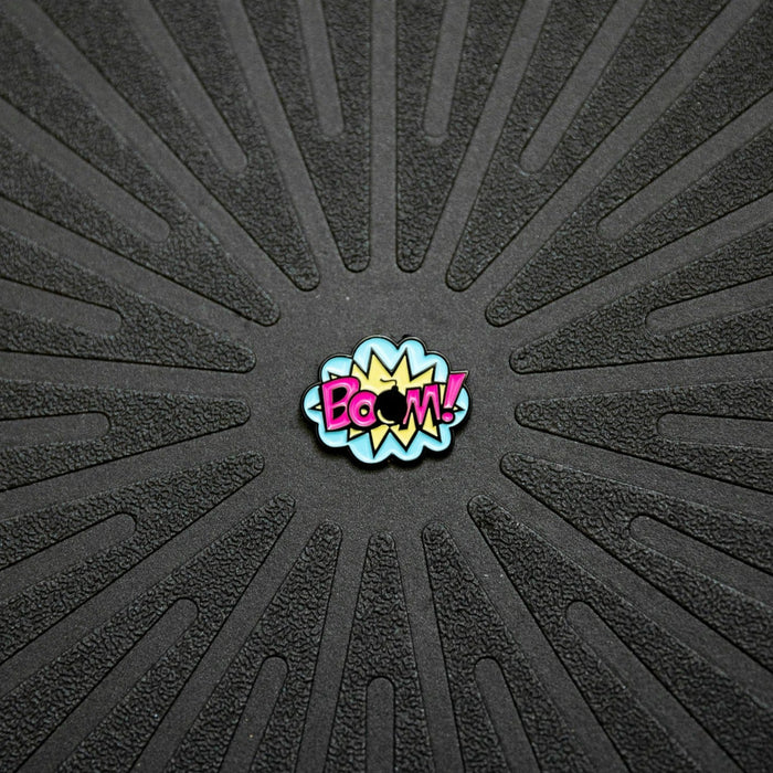 close up view of Pinsnickety's BOOM! horse show number pin