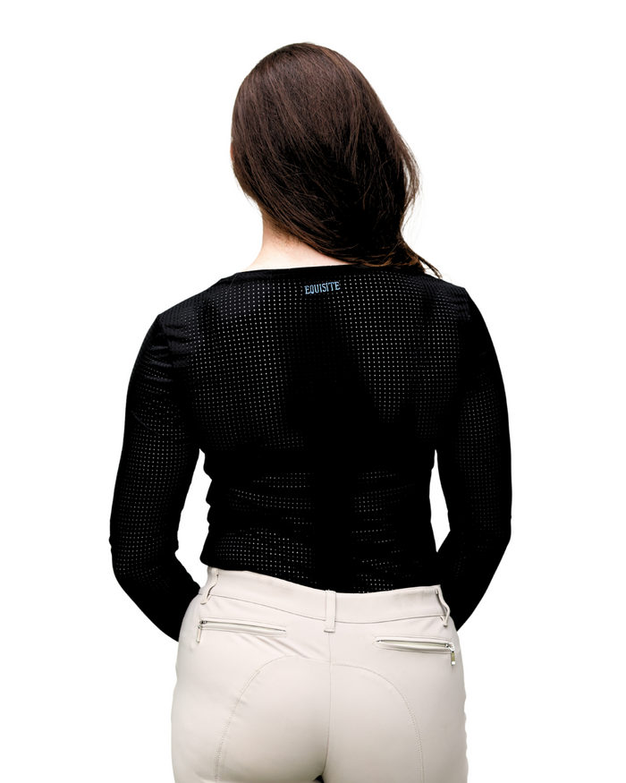 Woman wearing a black textured top with branding on a white background