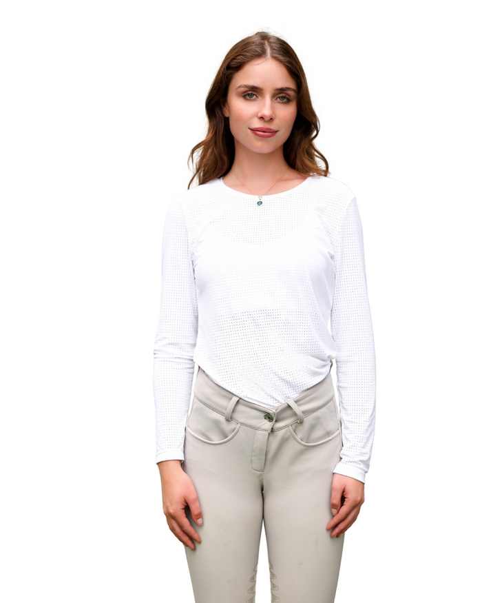 Woman wearing a white long-sleeve shirt and beige pants on a white background