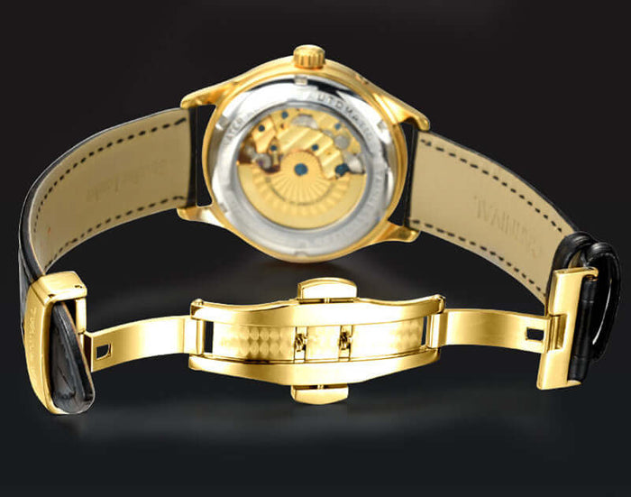 Carnival Full Automatic Mechanical Mens Watch showcasing the intricate gold movement and black leather strap from the back view.
