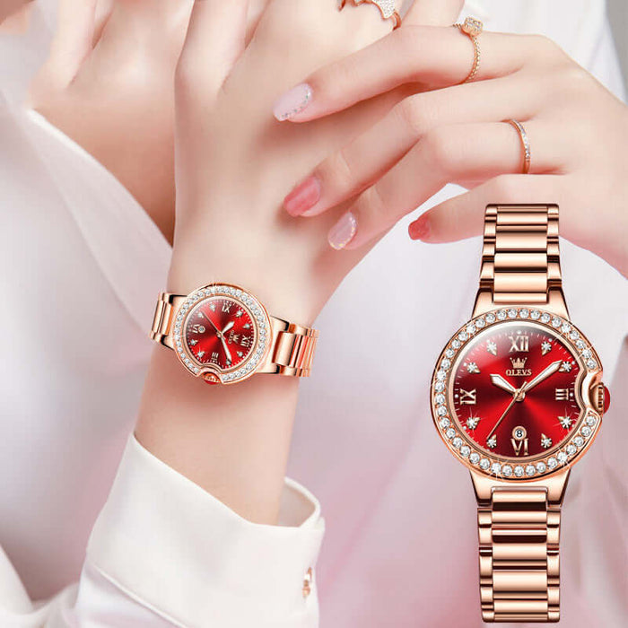 Elegant Waterproof Women Rose Gold Luxury Watch with a red dial and diamond accents on a stylish wrist.