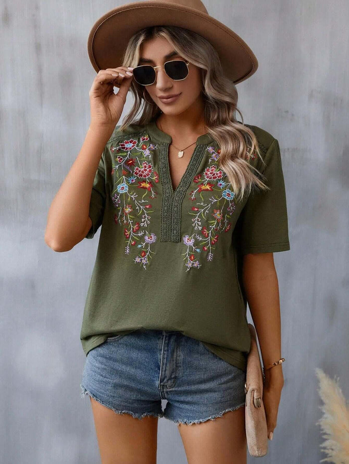 Fashion Flowers Embroidery Lace-collared Blouse worn by a model with sunglasses and a hat, styled with denim shorts.