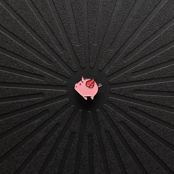 Close up view of Pinsnickety Flying Pig horse show number pin.