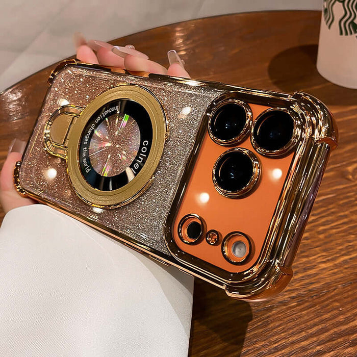 Four-Corner Airbag Drop-Proof Glitter Powder Phone Case held in a hand, showcasing glittery design and camera cutouts.