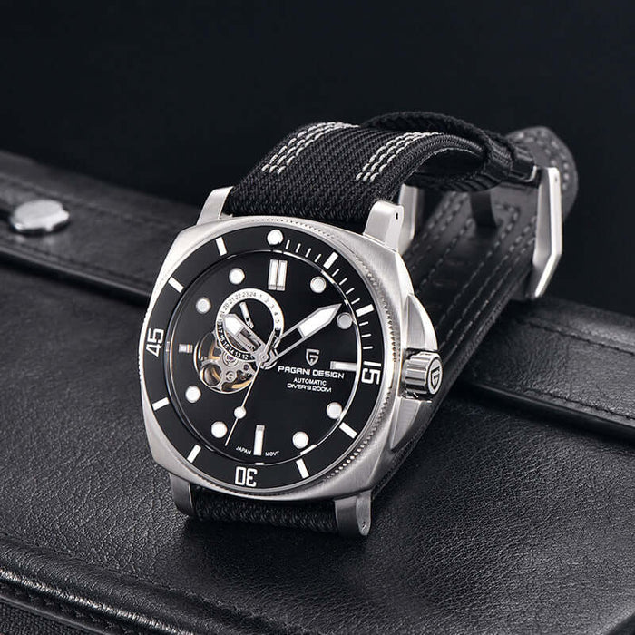Fully Automatic Mechanical Watch With Luminous Display For Men on a black strap against a leather background.