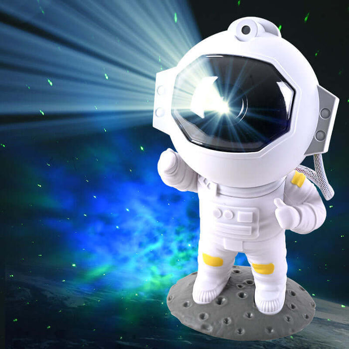 Galaxy Star Projector astronaut night light illuminating a cosmic scene with nebula effects and green stars.