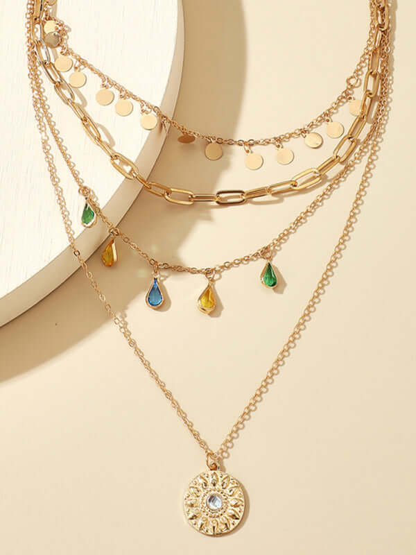 Geometric Disc Tassel Layered Necklace worn by model with black dress