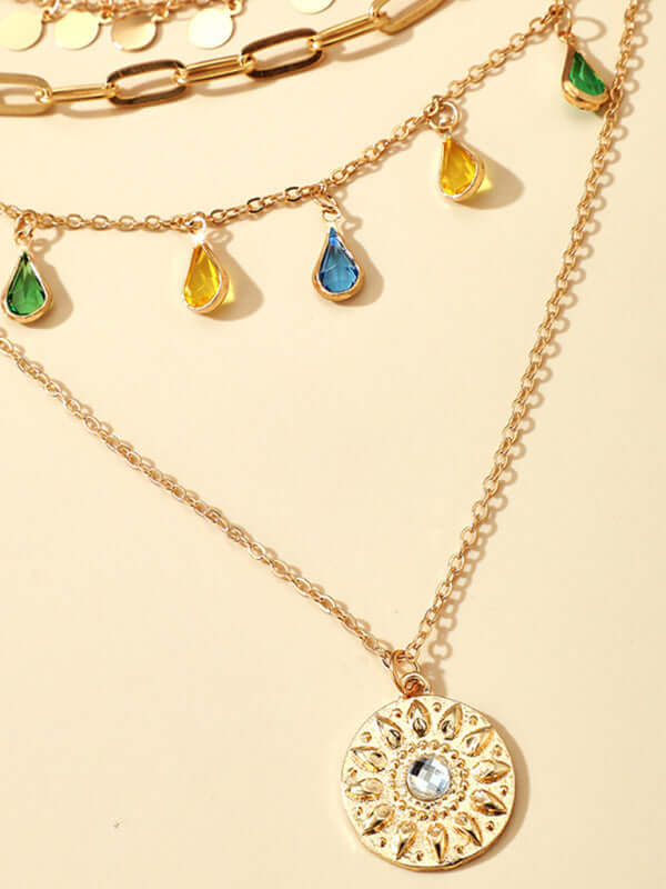 Geometric Disc Tassel Layered Necklace concave convex disc pendant detail