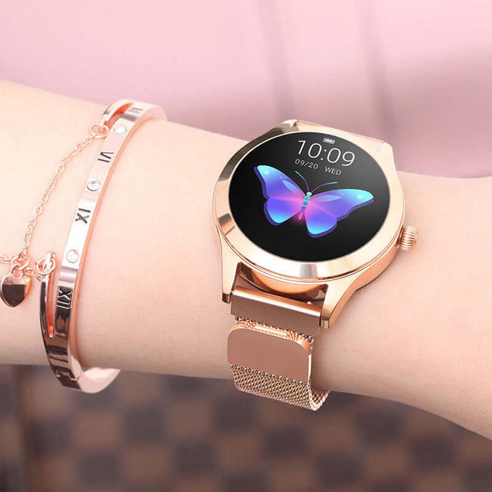 Heart Rate Monitoring Sports Step Smart Bracelet Slim with a rose gold mesh strap and butterfly display on a wrist.