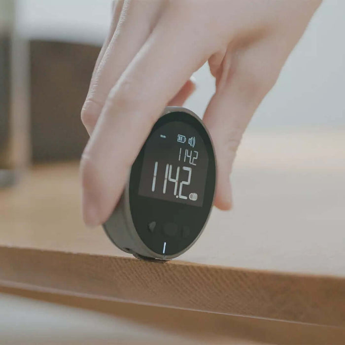 High-Precision Digital LCD Electronic Measuring Ruler being used to measure a surface with a digital display showing measurements.