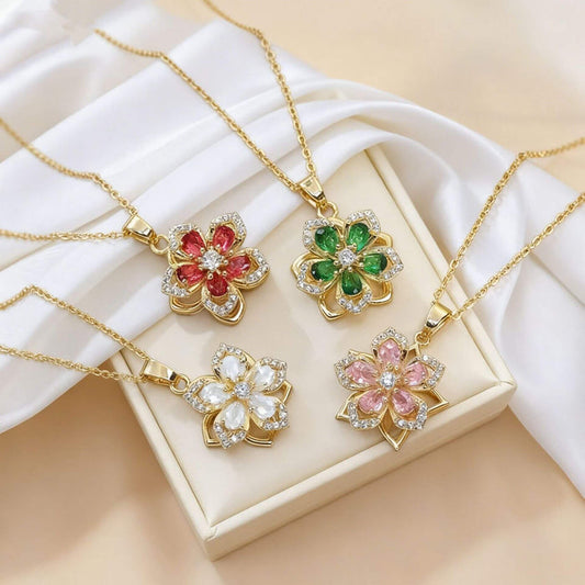 Ins Rhinestones Flowers unique rotatable necklace pendants in various colors displayed on a soft fabric background.