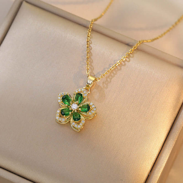 Ins Rhinestones Flowers Unique Rotatable Necklace Pendant featuring a gold chain and green flower design.