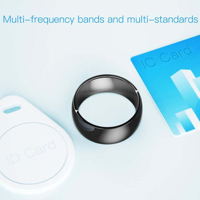 JAKCOM R4 Smart Ring Multifunctional Wearable with multi-frequency bands displayed with ID card and key fob.