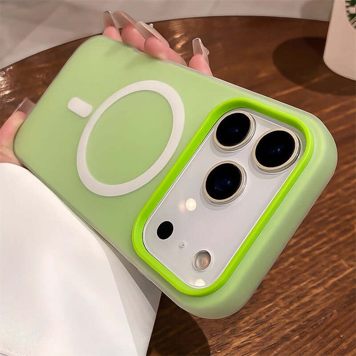 Hand holding a Jelly Magnetic Two-in-One Frosted Drop-Proof Phone Case in a pastel green color with unique design.