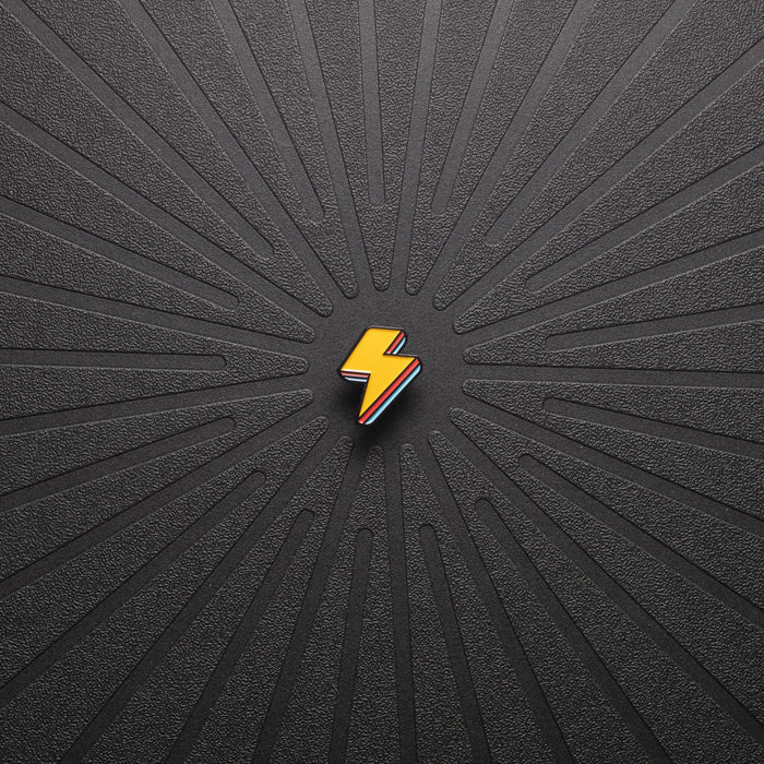 pinsnickety lightning bolt horse show number pin in special edition electric yellow alone on a black background