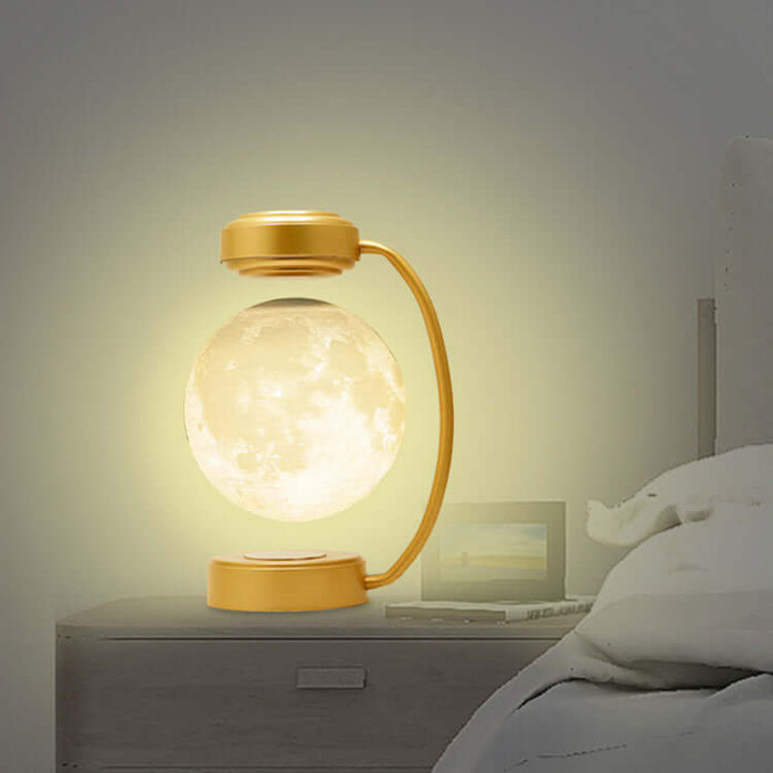 Magnetic Levitating Moon Lamp providing ambient light on a bedside table.