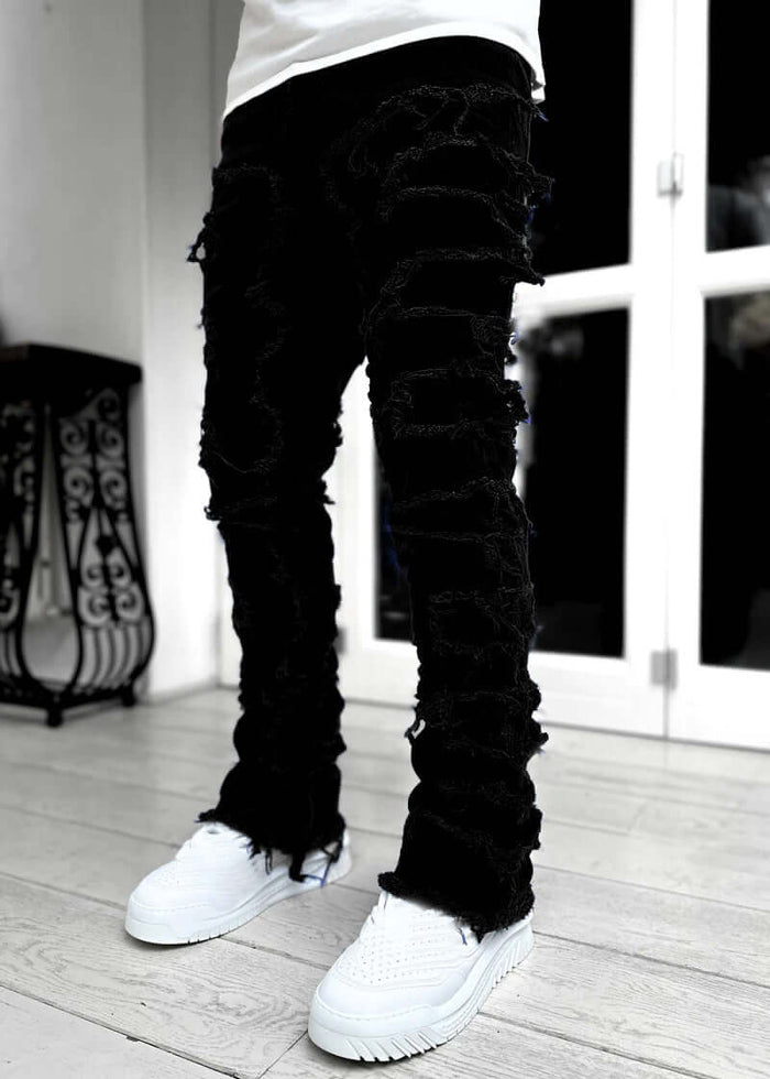 Men Ripped Stacked Slim Fit Jeans Streetwear with ripped details, styled for a modern urban look.