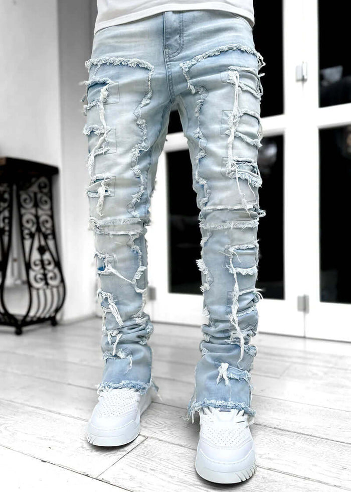 Men Ripped Stacked Slim Fit Jeans Streetwear showcasing a distressed design with ripped details and a slim fit.