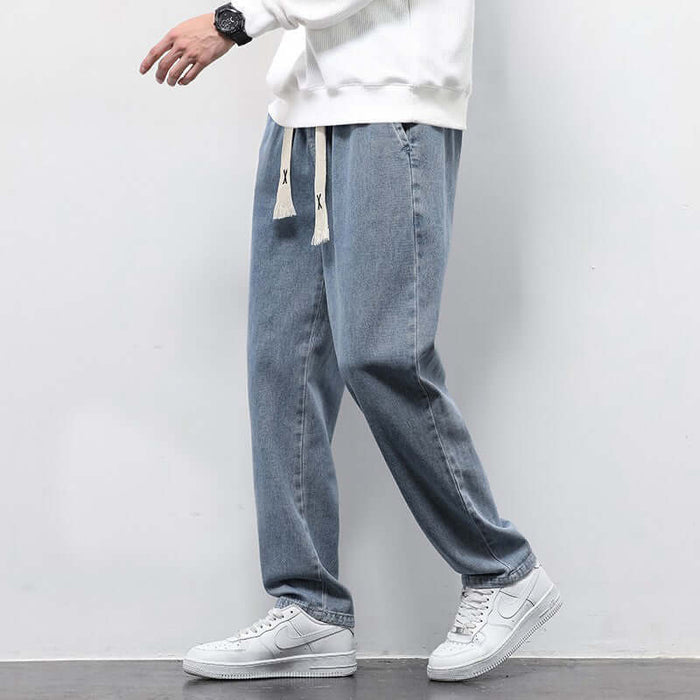 Men's Summer Loose Wide Leg Drawstring Jeans side perspective tracing the fluid wide straight leg drape properties