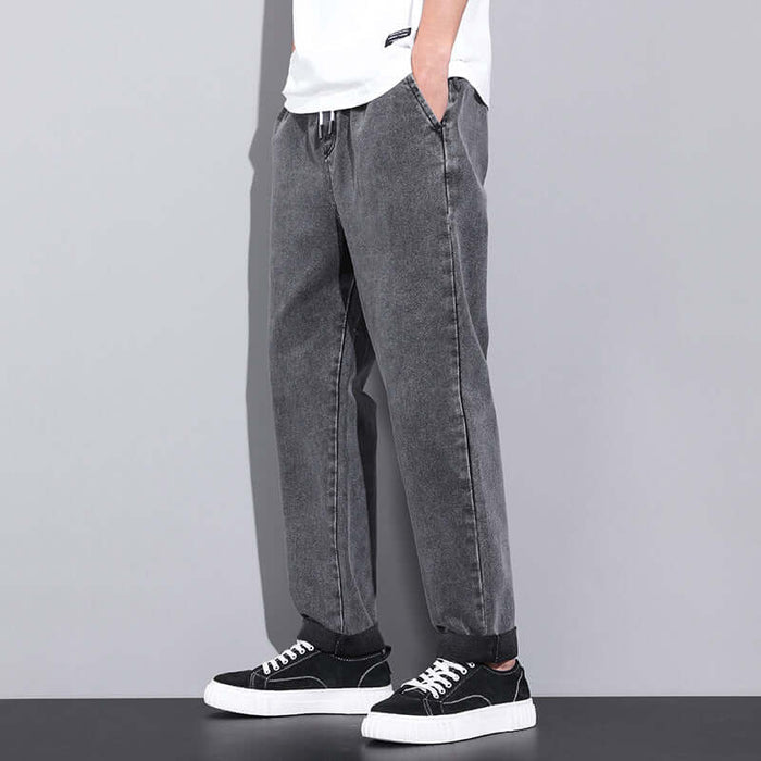 Men's Summer Loose Wide Leg Drawstring Jeans folded neatly showcasing double overlock stitched bottom ankle hem borders
