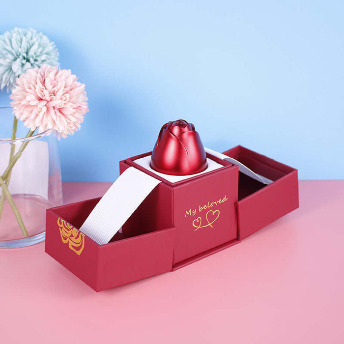 Metal Rose Jewelry Gift Box with Crystal Necklace displayed alongside colorful flowers in a decorative setting.