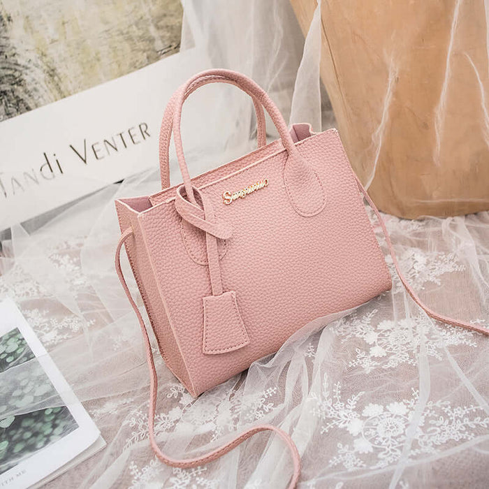 New Product Personality Messenger Phone Shoulder Bag in soft pink leather with stylish handles and detachable strap.
