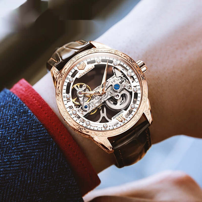 Openwork Mechanical Watch With Waterproof Leather Strap showcased on a wrist, featuring a detailed skeleton design and brown leather strap.