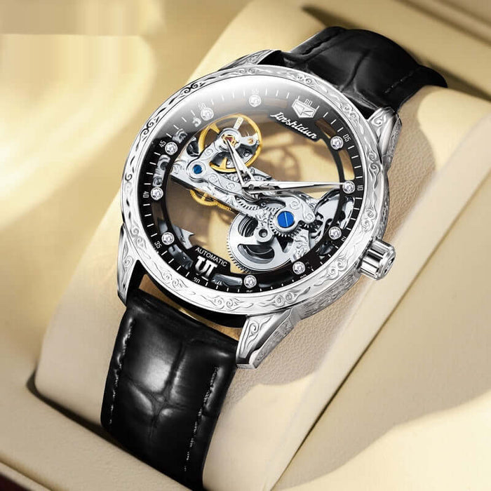 Openwork Mechanical Watch With Waterproof Leather Strap displayed on a soft surface, featuring a black leather strap and intricate design.