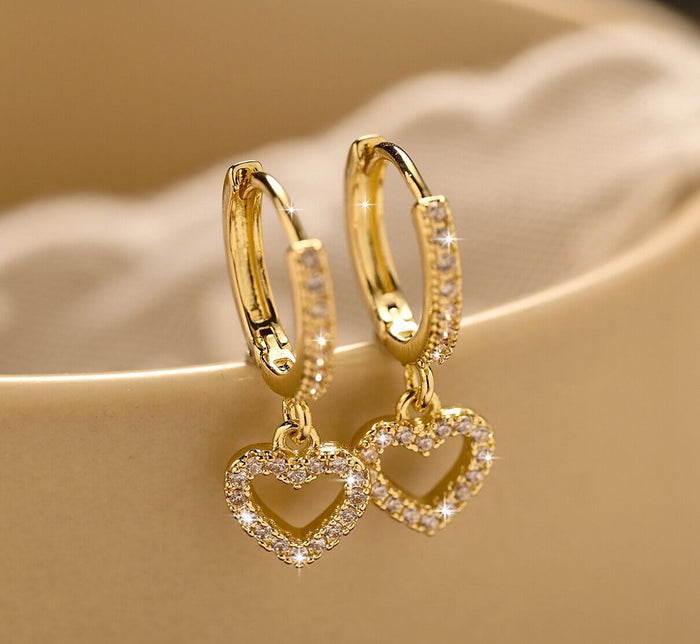 Retro Heart-shaped Pendant Ring Zircon Earrings displayed against a soft background in a gold finish.
