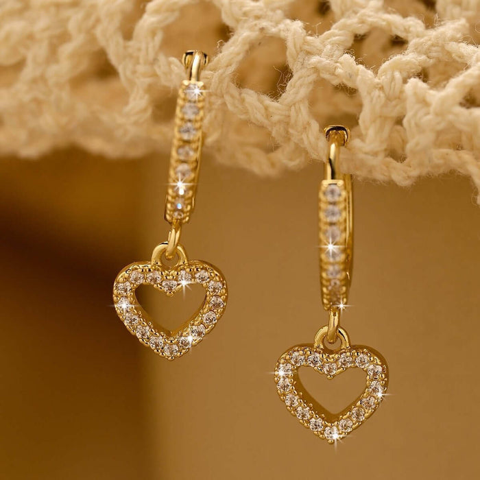 Retro Heart-shaped Pendant Ring Zircon Earrings in gold with sparkling details.