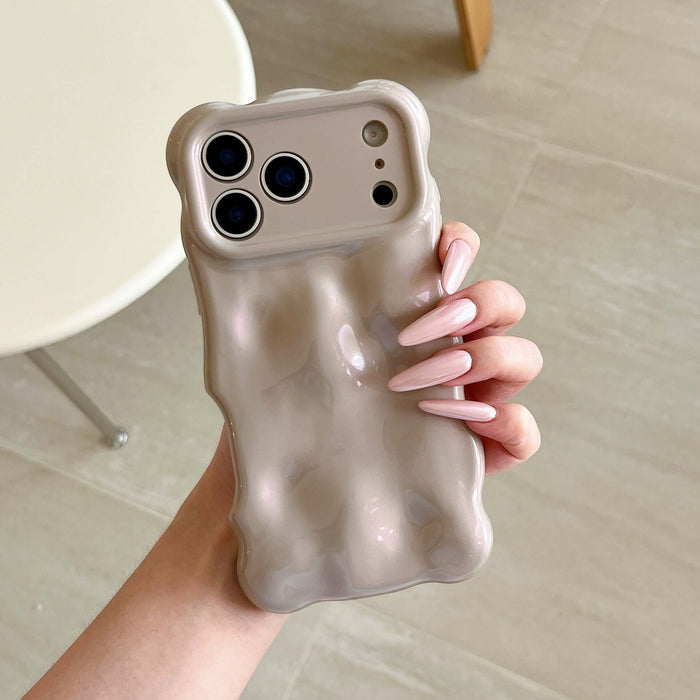 Simple Bubble Wave Pearl Drop-Proof Phone Case Cover held in hand with stylish long nails.
