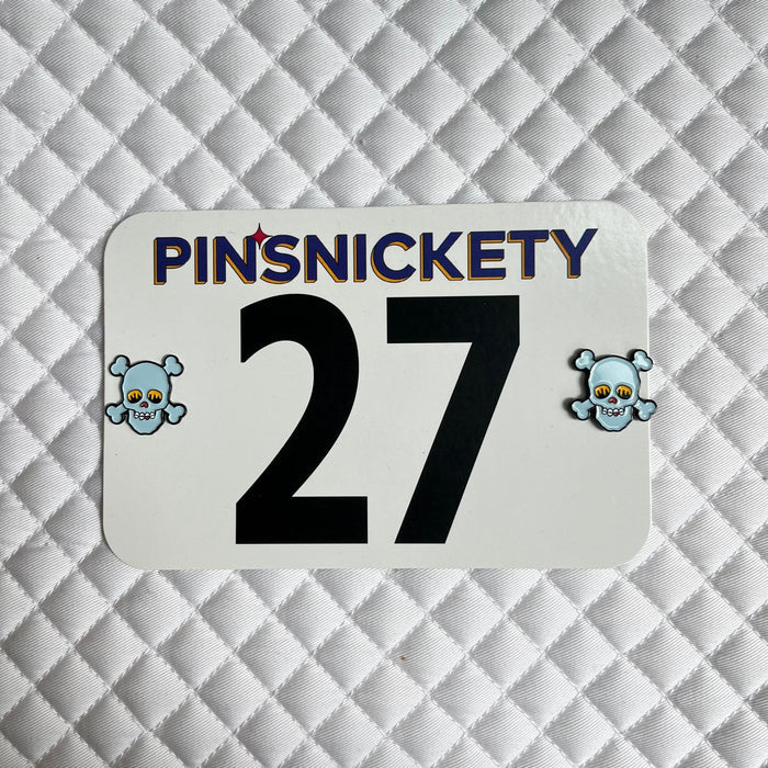 pinsnickety blue skull horse show number pins on a saddle pad