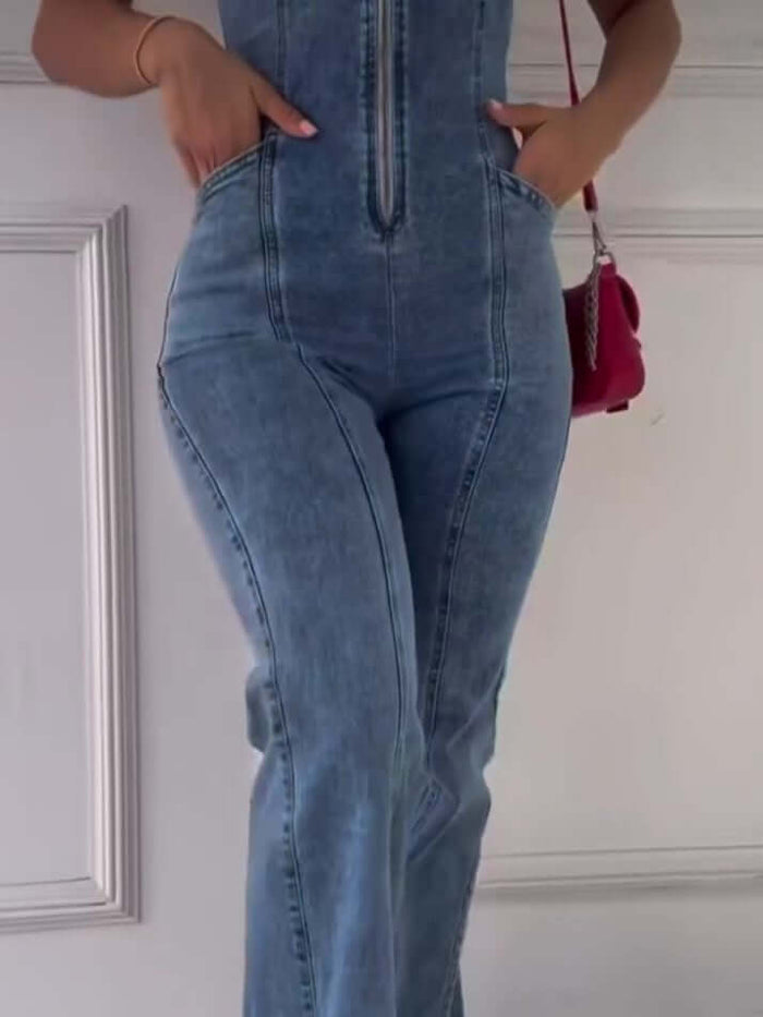 Sleeveless Paneled Zipper Denim Jumpsuit on a model, featuring a zipper front and side pockets.