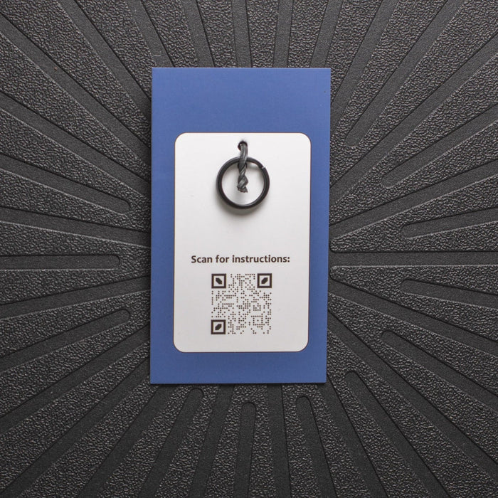 pinsnickety charm back, showing black split ring and qr code