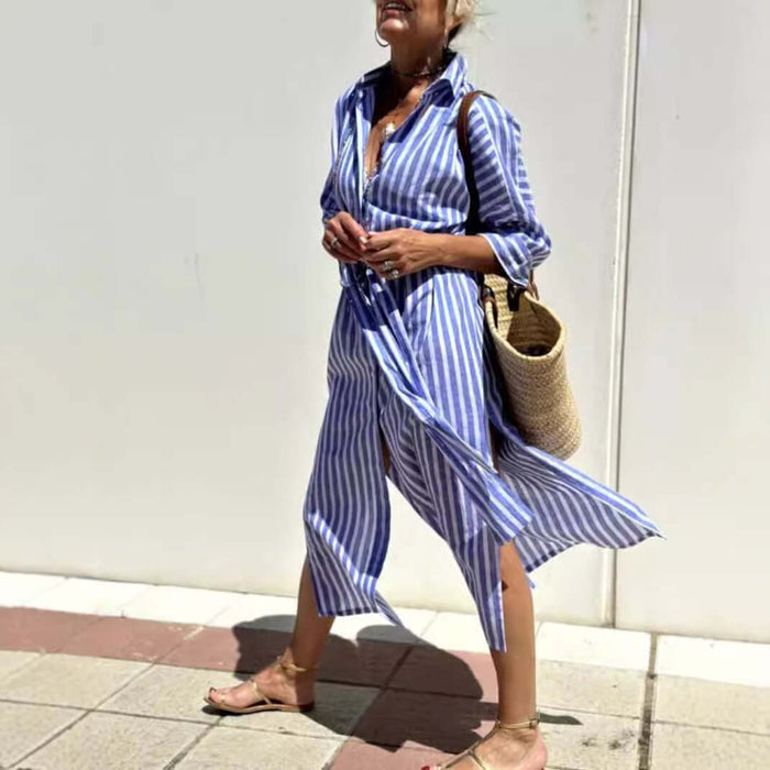 Striped Half-Sleeve Belted Lapel Shirt Dress worn by a woman walking with a straw bag in a sunny outdoor setting.