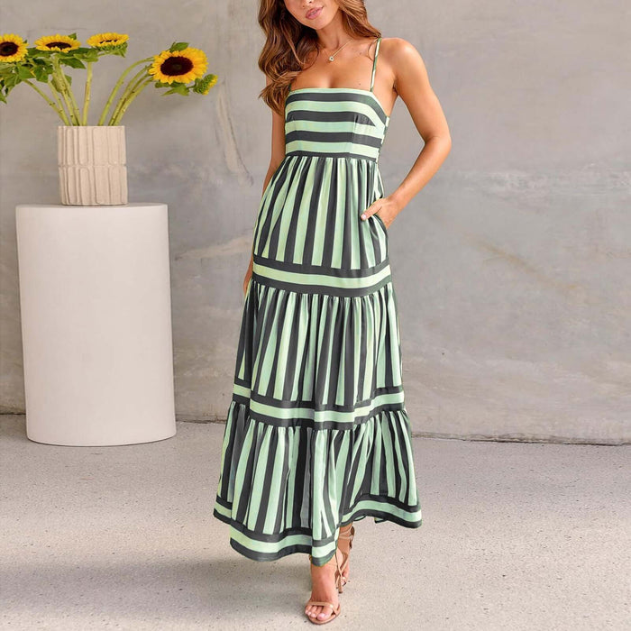 Summer Striped Suspender Long Beach Dress with Pockets modeled by a woman standing indoors.