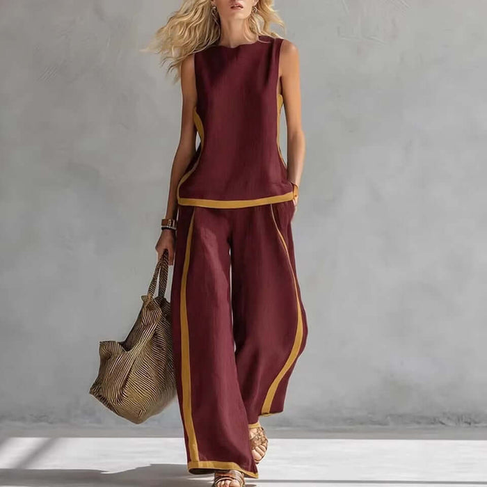 Summer Suits Sleeveless Vest And Wide Leg Pants Set worn by a model in a stylish pose with a bag.