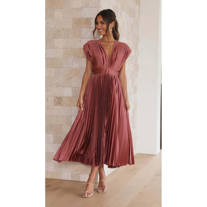 Summer V Neck Pleated Sleeveless Maxi Dress in a pink tone worn by a woman standing indoors.