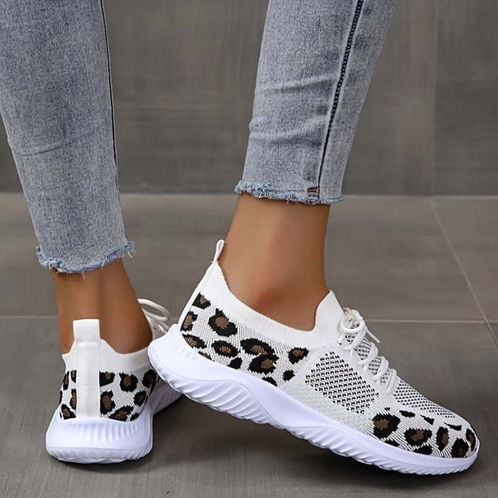 White Shoes Women Leopard Print Lace up Sneakers worn with denim jeans.