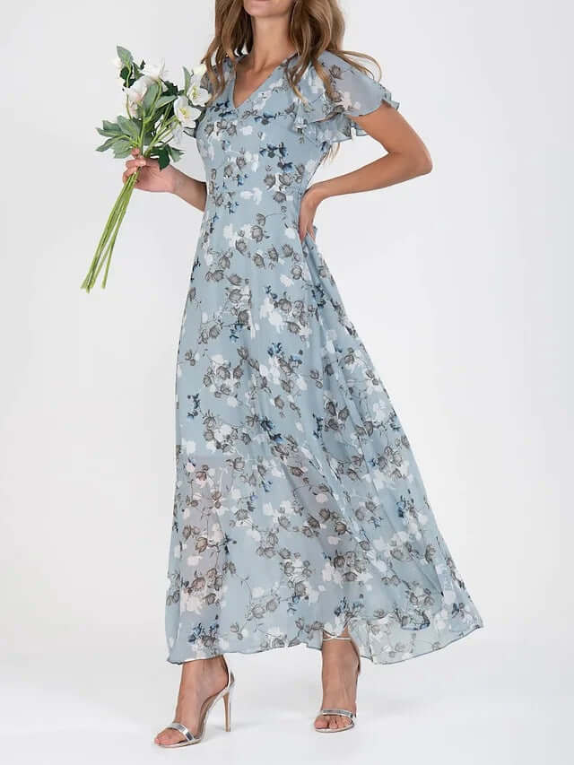 Women Floral Short Sleeve V Neck Beach Maxi Dress in blue with floral patterns, worn by a woman holding flowers.