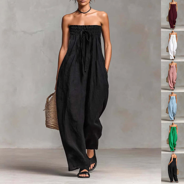 Women Strapless Ruched Jumpsuit Summer Fashion in black, styled with a woven bag and casual sandals.