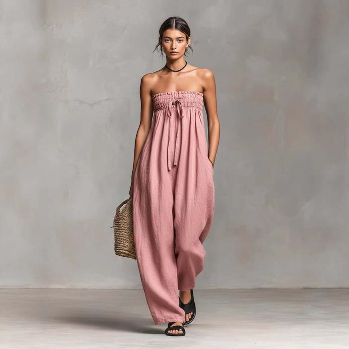Women Strapless Ruched Jumpsuit Summer Fashion modeling a stylish, relaxed fit in a soft pink color.