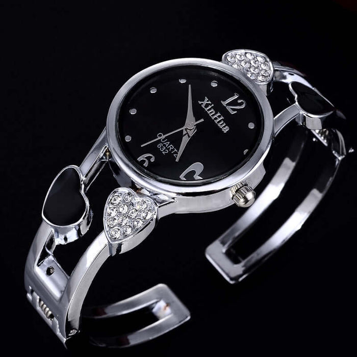 Women's British Diamond Watch featuring a sleek silver bracelet with heart-shaped accents and a black dial.