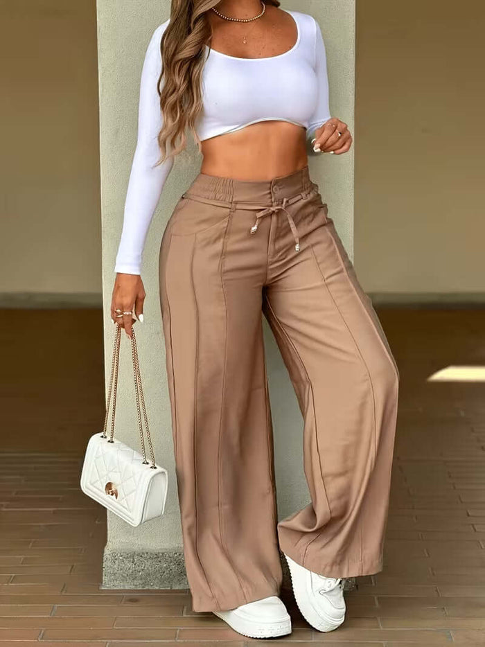 Women's High Waist Wide Leg Drawstring Multi Pocket Pants, styled with a cropped top and a stylish handbag.