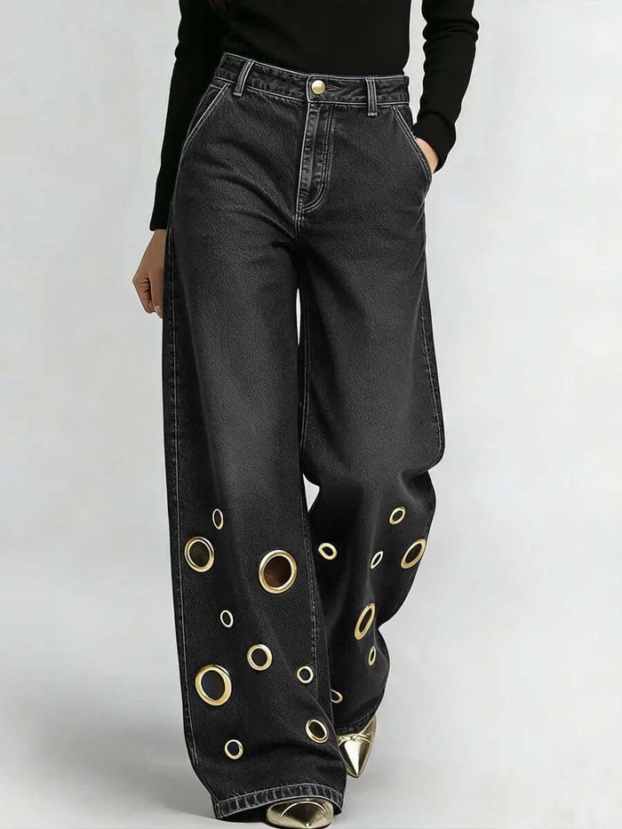 Womens High-waisted Loose-fit Denim Jeans With Cutout Design featuring a stylish black fabric and circular cutouts.